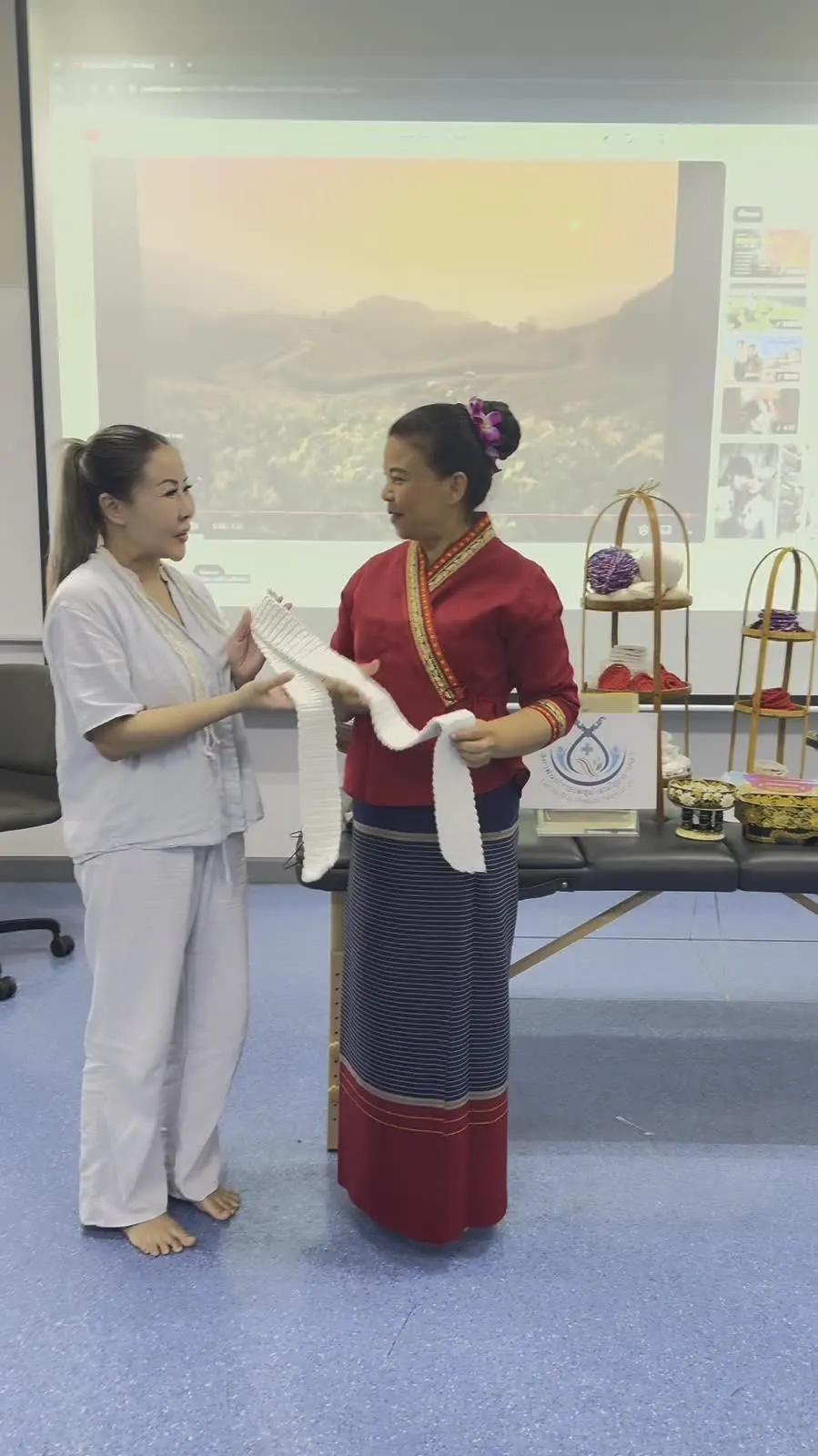 Mo in Lanna dress teaching at the Chiang Mai school